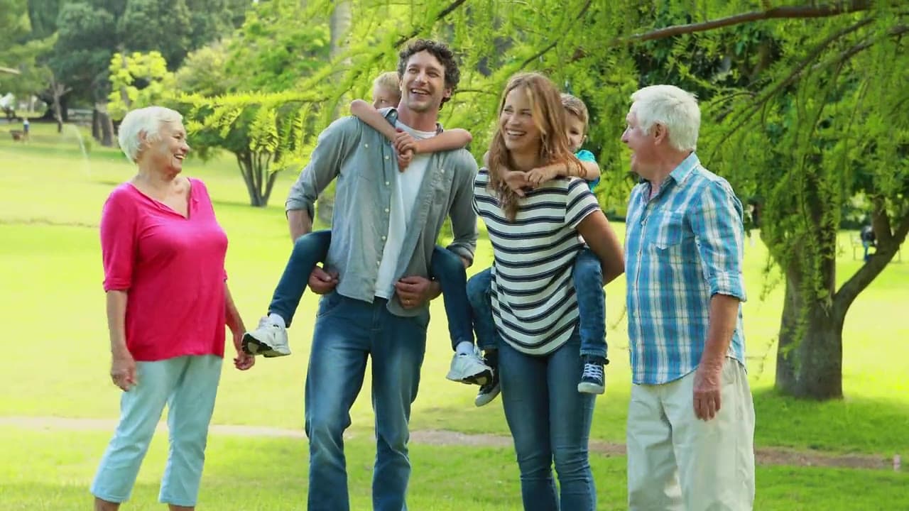 A multi-generational family enjoying time together in a park